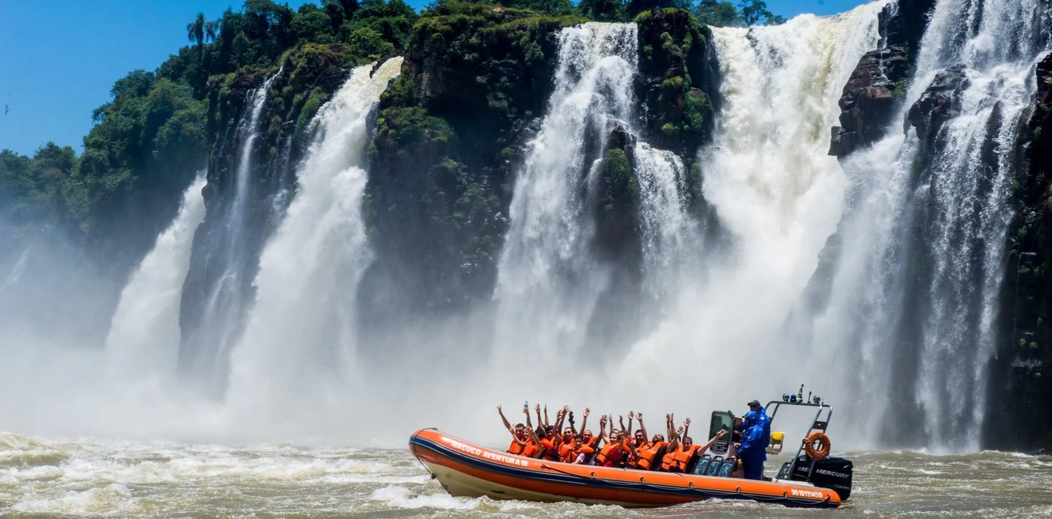 Speed boat approaching Iguazu Falls on the Macuco Safari